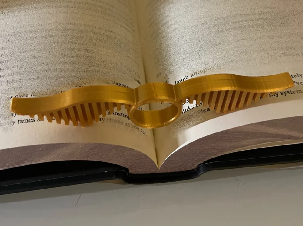 Winged Golden Ball Page Holder